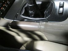 Emergency brake handle cover is original and is like new.