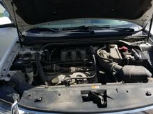 Before Photo 2008 Ford Taurus with 145k, engine bay never cleaned.