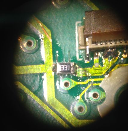 Two 330 Ohm resistors stacked. Cut and removed a piece of the trace and soldered this resistors across the cut.