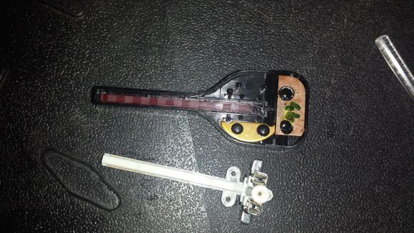 stock gauge needle with white LED plastic innards removed. to remove the white innards use a tiny (eyeglass size) angled screwdriver pick on the black plastic circles that hold it in place (ex. see in this picture the 4 black plastic pieces remaining on the needles counter-weights). DO NOT Remove the Counterweights! you will regret it.