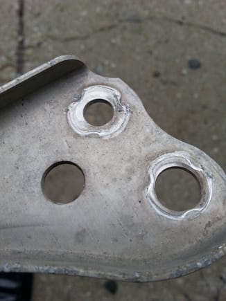 The surface is shiny wher mounting nuts clamp surface suggesting movement..When removing brace (vrear wheels on ramps) it shifted slightly while removing nuts, suggesting it is not only there to restrain a broken driveshaft. Would replace  it with a steel brace but body studs are flimsy.