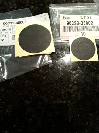 OEM hole plug "plates". Two sizes "cover" everything.