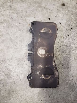 This is the pad that was removed. It had a second stainless steel shim plate glued to the metal plate on the back of the pad. The new pads did not have this second shim plate so I removed them from the existing pads and installed them on the new ones. I used caliper grease, see next photo.