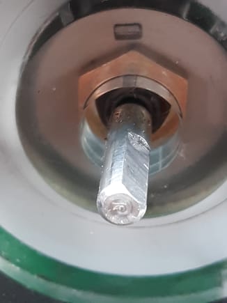 There appears clearance for a rotary shaft seal behind light pipe. The shaft flat does not extdnd down to threaded bushing, so a rotary seal will work.
The nut is removed and replaced by shaft seal with integral nut.