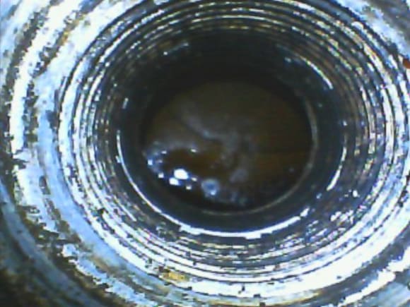 600 spark plug hole.  I dipped my borescope in that puddle.