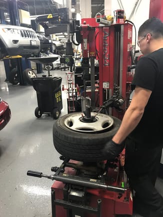 Tire mounting equipment with correct centering inserts and fixturing to prevent scratching and gouging of Aluminum Lexus rims.