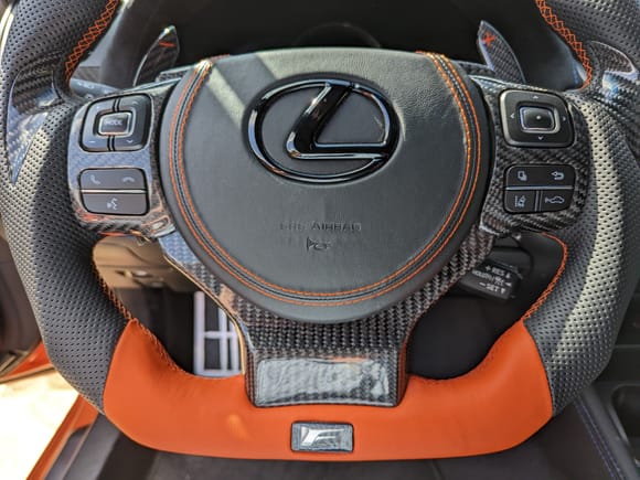 Orange flat bottom, carbon fiber trim replacements, new airbag cover with matching stitching.