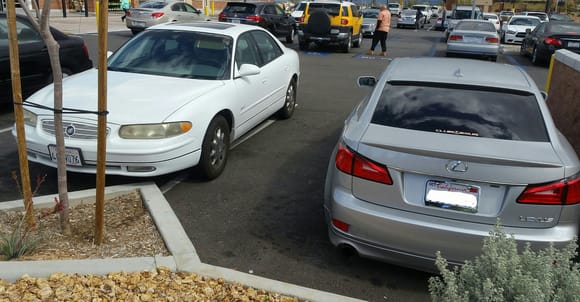 This happened a few hours ago at my friendly neighborhood Walmart market. Good thing I park as far to the end as possible in case of these situations. I actually watched this old lady parking like this and walked up to my car to watch her open her door. She's lucky she didn't swing it wide!