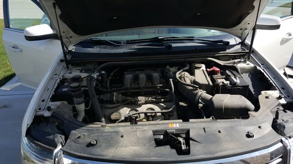 Before Photo 2008 Ford Taurus with 145k, engine bay never cleaned.