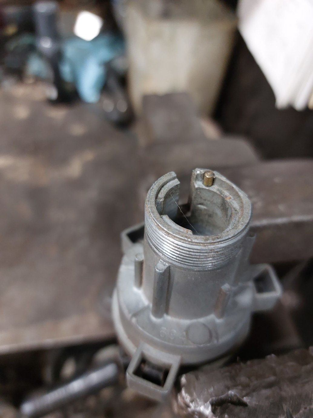 Brass pin in switch housing.