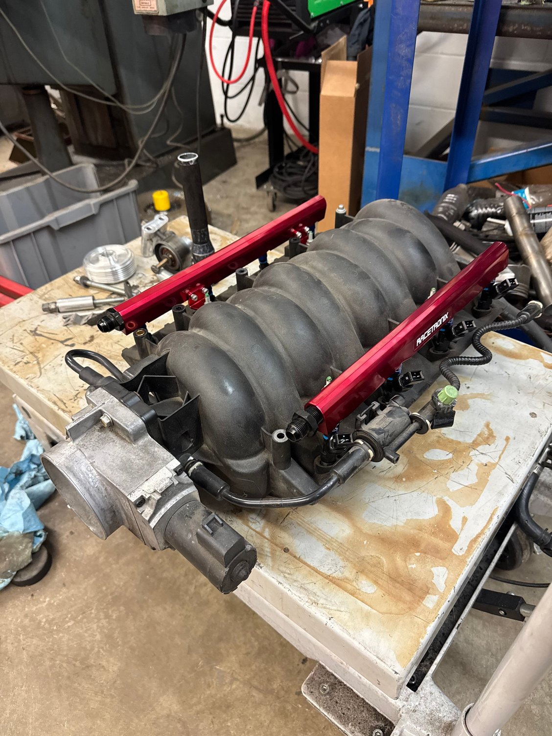 Racetronix fuel rails on stock TB on the LS6 intake. 