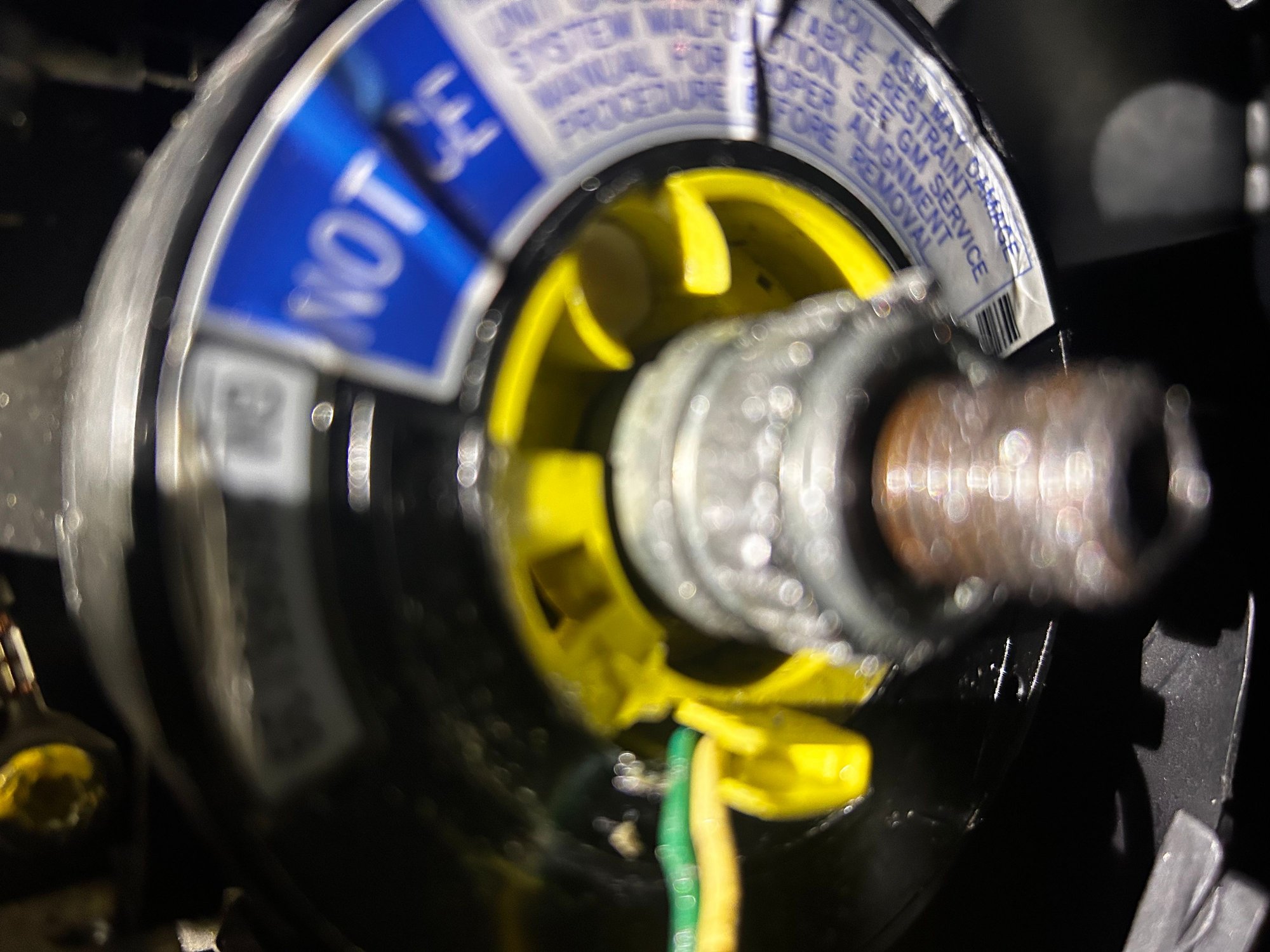 I�m having problems finally got old wheel off , what�s left of it anyway. Now there is this thing in the way the new wheel won�t slide over the shaft , should I cut that thing off?