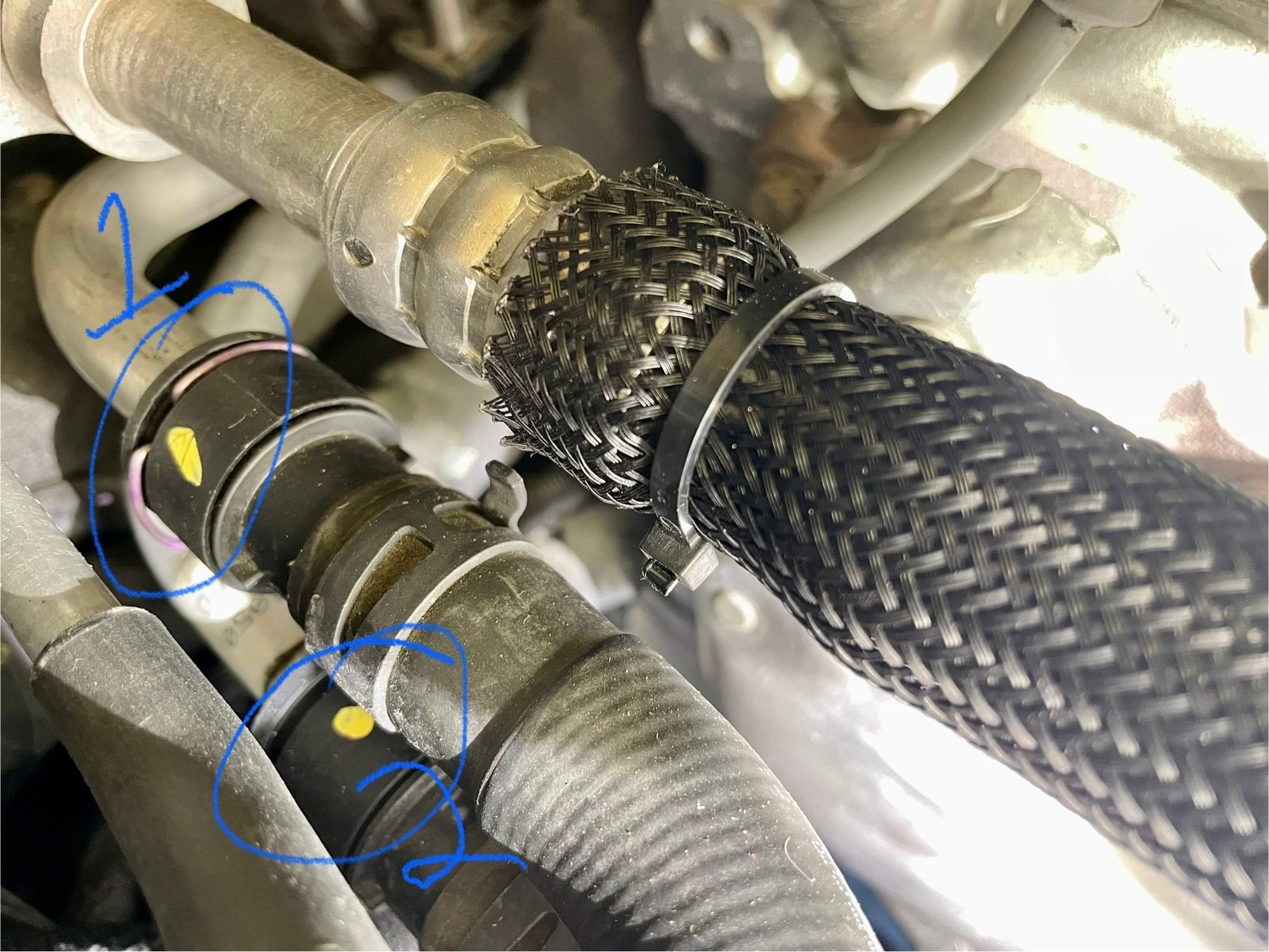 #2 was not leaking.  These 2 hoses, along with the coolant tank hose and the y-connector, make up the heater hose kit mentioned in this and other threads.  