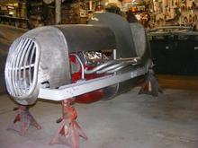 side shot of a midget race car with a v8-60 engine