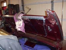 Put a 7/16”x7/8”x 43” long thin steel rectangular tube on the back side of the deck lid flange to spread the load by clamping the fiberglass between the assemblies.
Pop riveted a 1”x1”x1/16” x 43” long aluminum hinge to the 3/8” aluminum bar. The hinge sticks down approx. 1/8” below the 1” aluminum bar. The goal was to fold the wind screen under the deck lid when not in use. Forrest would have been smarter than to forget about the release handle, stupid is as stupid does. 

