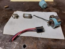 The flag connector fits over the male lug on the flasher and then the plug assembly is pushed onto the flasher.