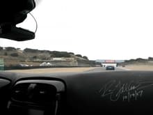 2009 ALMS Laguna Seca, Parade Lap. You can see my Ron Fellows dashboard signature. My passenger, Megan, is taking the picture.