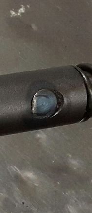 I have what looks like play in this pin. I assume this just goes through a hole in the lower shaft to the other side. I couldn't find schematic for the internal parts for the shaft assembly. But I am thinking the pin or the hole it goes through is worn out.