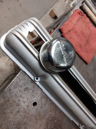Edelbrock used to make breathers with wool baffle. I cut the old valve cover to use adjusting valves.