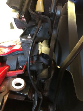 The top ring is attached to a bolt also, but the cable has been cut