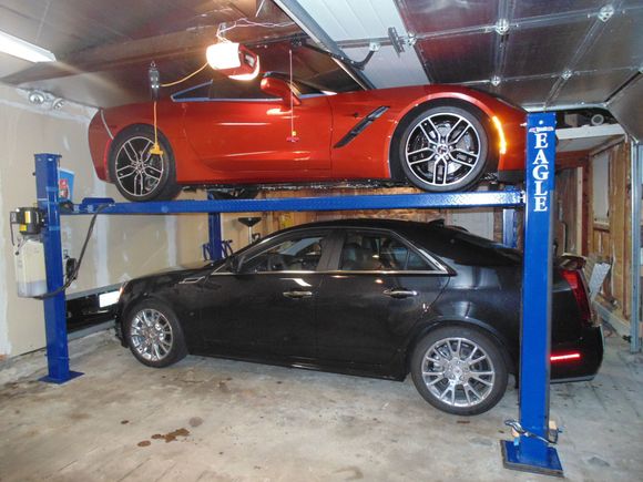 These shows the opened door right above the hood of my C7.  I can fit my CTS-4 under the lift.