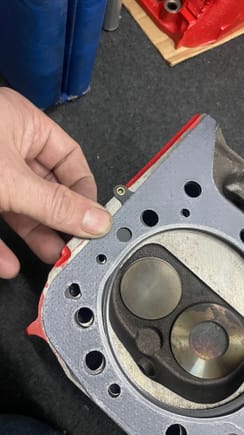 Front hole in MLS Gasket (background at my finger) does not exist - the Felpro gasket has this hole
