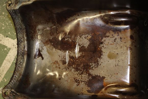 Oil pan contains evidence of an earlier major engine issue.