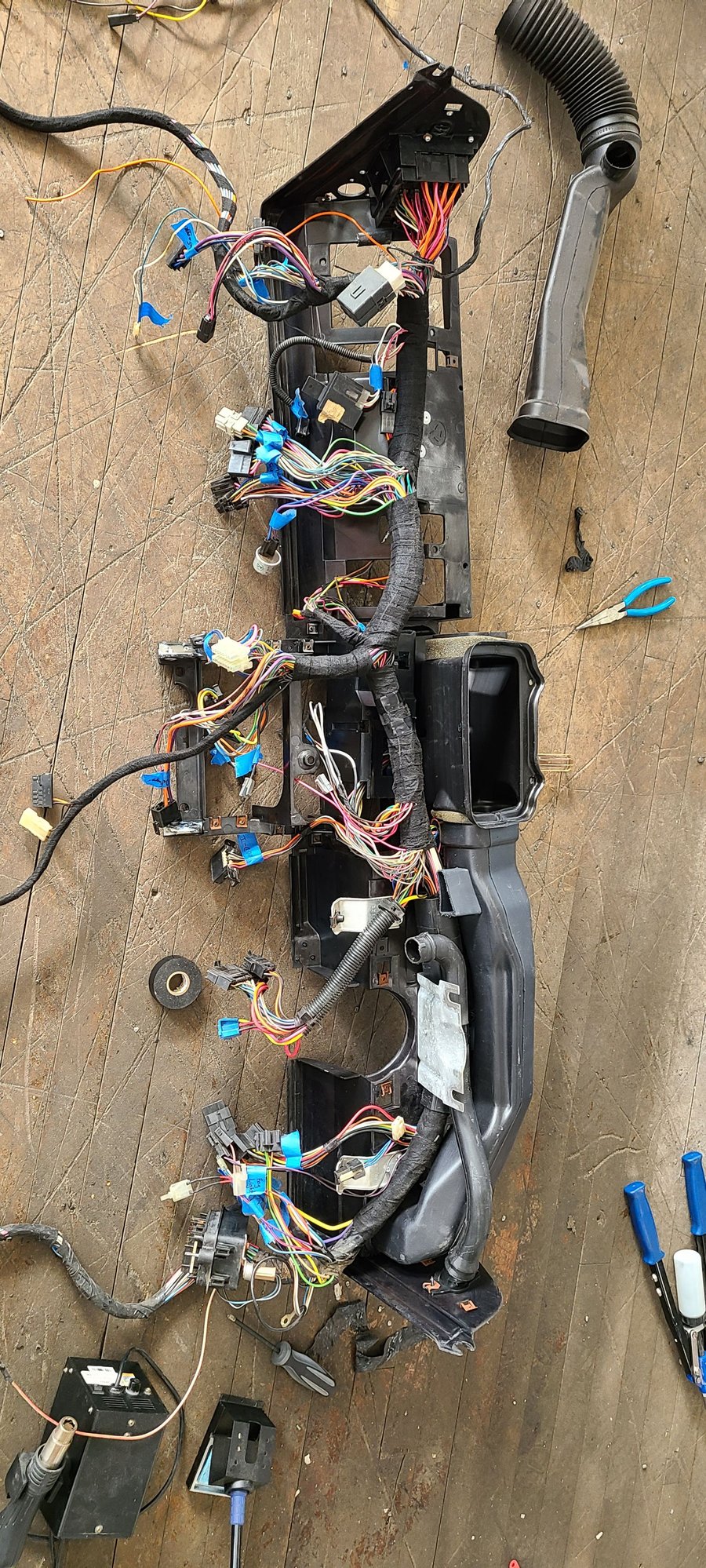 Repaired the dash mount points with epoxy and reinforced with aluminum. Placed the harness back into the dash.