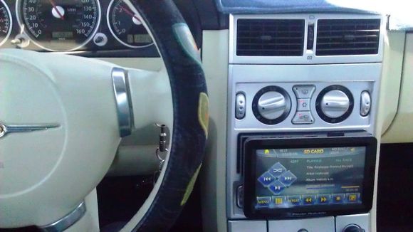 Current radio head unit, playing via an SD card (inserted on top right)