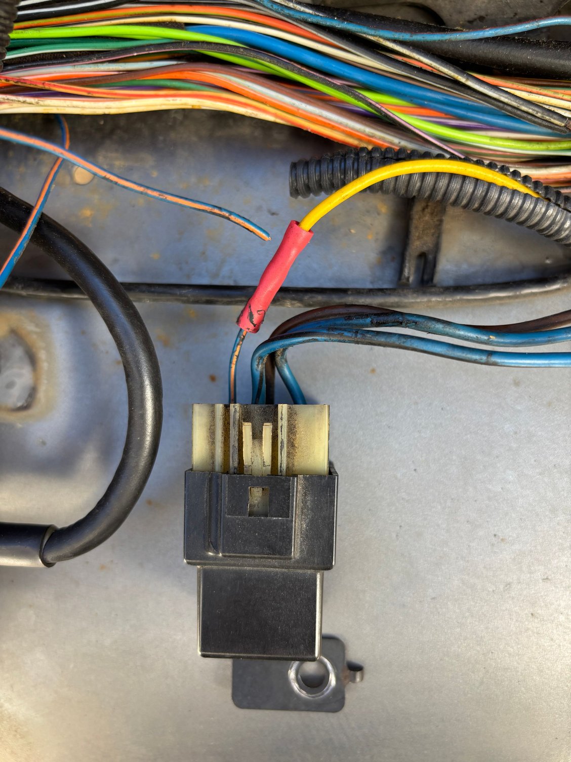 The WOT /AC clutch relay and where the yellow wire originates 