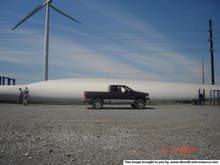 posing with a windmill blade