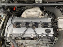 Aluminum valve cover freshly installed. A lot of the wire clips have to be fabricated.