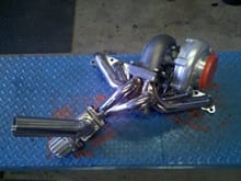 T-70 with .96 a/r hotside, 50mm external wastegate and tubular manifold for 2jz