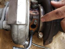 Oil line was pinched but i left on good copper gasket + bolts