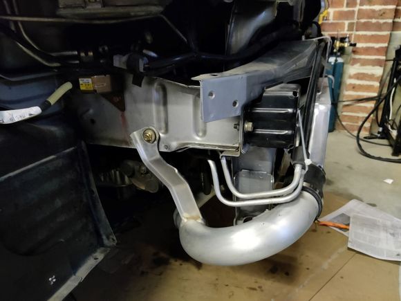 Bracket mounted with a nutsert. The power steering lines were a pain. In the end i cut them and re-routed