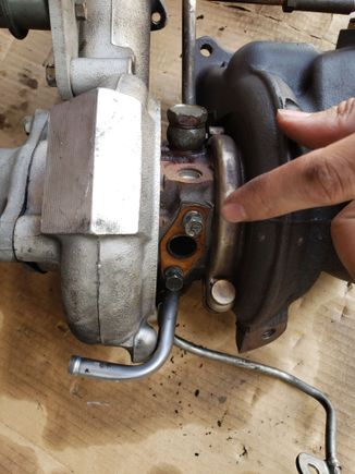 Oil line was pinched but i left on good copper gasket + bolts