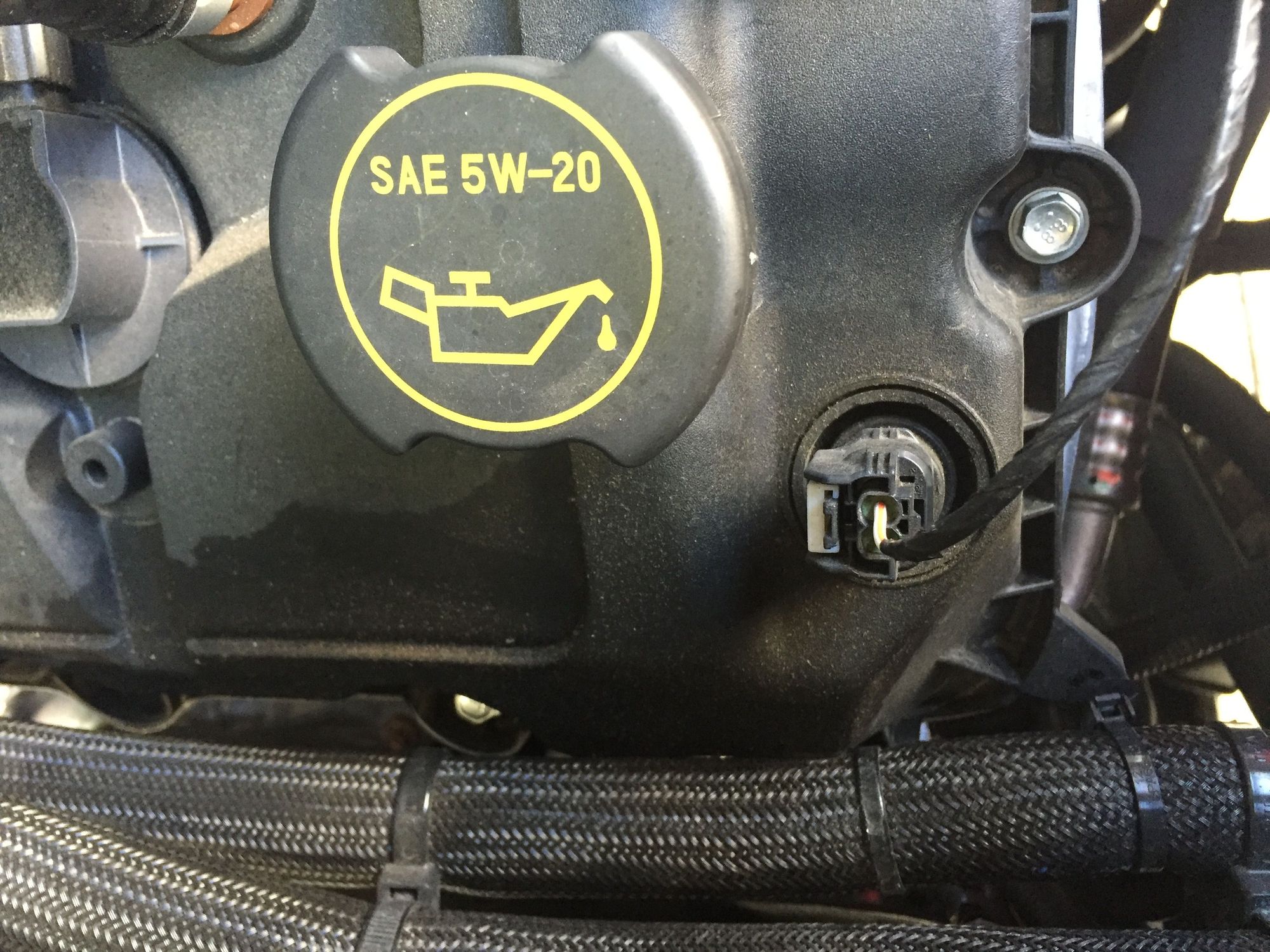 coolant leak and oil leak around sensor on valve cover 5.0 Ford F150