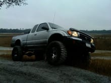 my 4th truck- 00 tacoma put a 4'' suspension and 3'' body 35 mud graps- SUNK IT