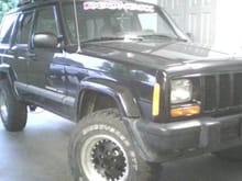 my old jeep, my first car. painted rims my self!