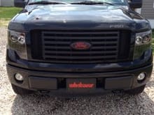 Plasti-dipped front emblem with custom red Ford logo and plasti-dipped grill :)