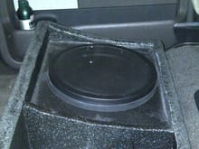 Memphis audio non ported sub box w/screen for protection. Only 2 wires to quick disconnect and whole box lifts out.