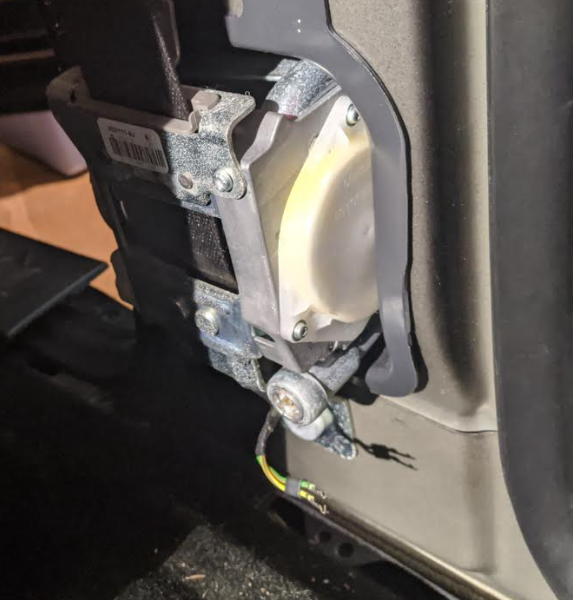 Sensor, passenger side, directly below seat belt spool for front seat