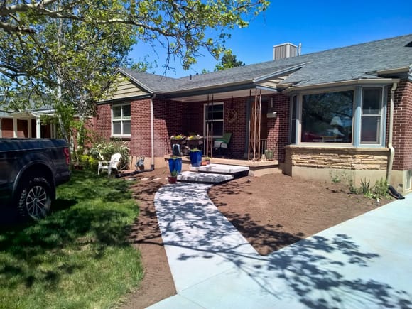 finished landscaping project with 3 1/2 yards of dirt shoveled out of the back.
