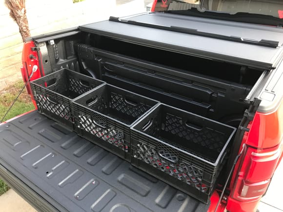 I purchase the OEM bed divider and ordered some milk crates off Amazon to provide a place to toss groceries, etc so they don't fly all over the back and so I don't have to put them in the truck. It all pops out easy enough and goes in the garage if I need to haul something.