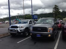 First day of purchase.  Sitting next to my Toyota trade-in.  I don't miss that old Toyo