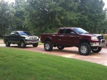 my buddies king ranch with a leveling kit and 35'' toyo mt's and my truck with the bull bar