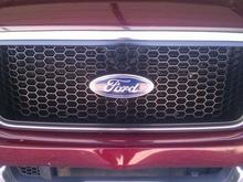 Newly painted gloss black grill.
