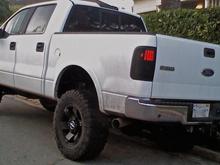 rancho lift plus 1.5inch puck front 1.5inch shackle rear and ride rite to level it out (rear shackle did not do what it claimed) 35/12.5R18 dick cepek mountain cats