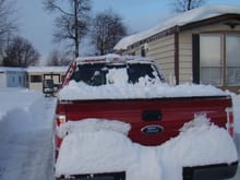 Truck with snow in bed leveled out