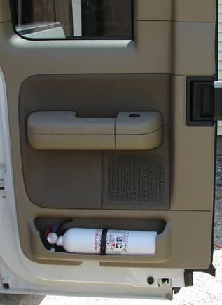 Fire Extinguisher.  I wanted a fire extinguisher handy.  Found with a little modification, the rear door fit the bill.